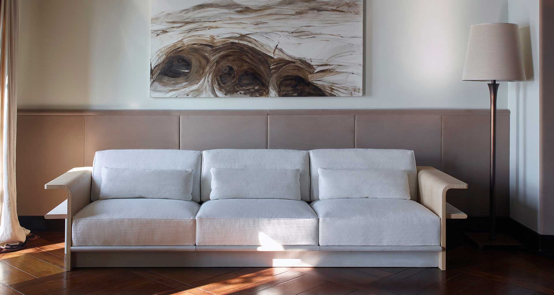 A considered interior with sculptural furniture and layered textures