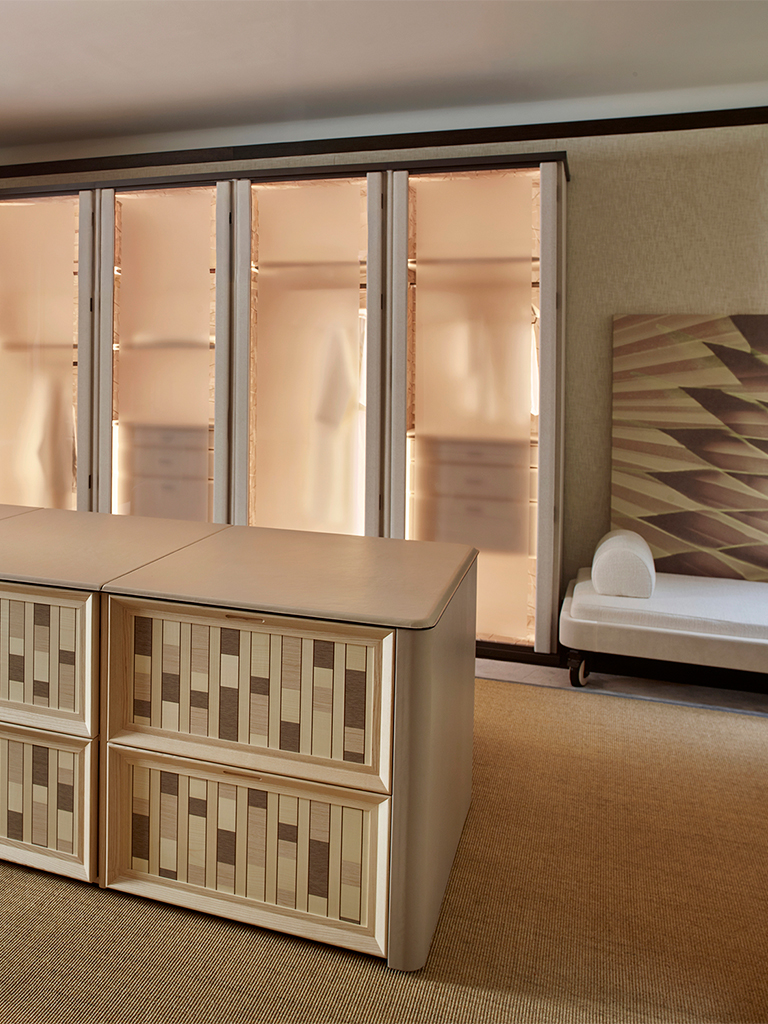 A considered interior with sculptural furniture and layered textures
