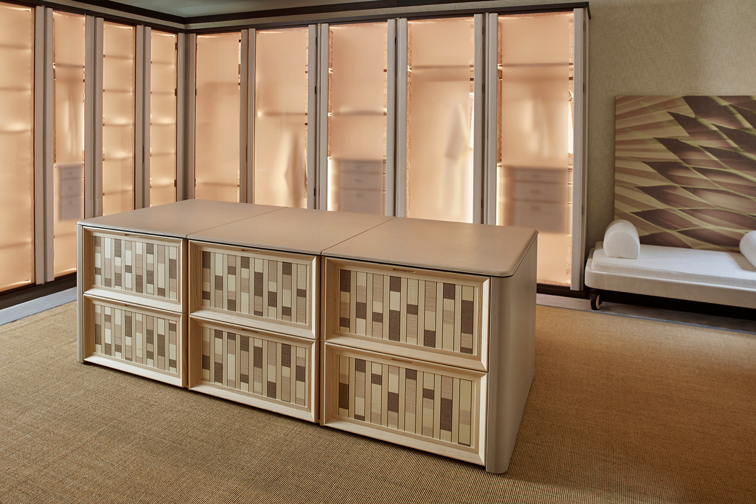Wardrobe interior with tactile surfaces and softly lit details