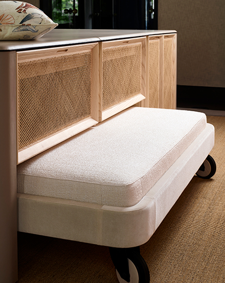 Wardrobe interior with tactile surfaces and softly lit details
