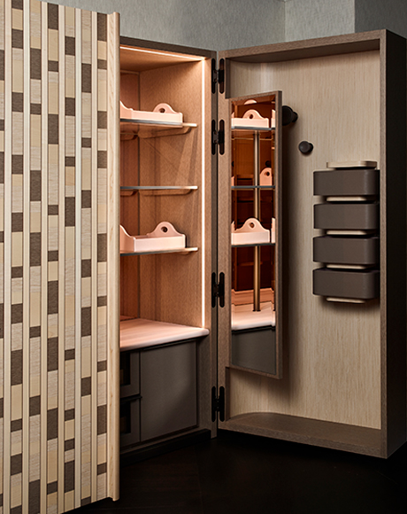 Wardrobe interior with tactile surfaces and softly lit details