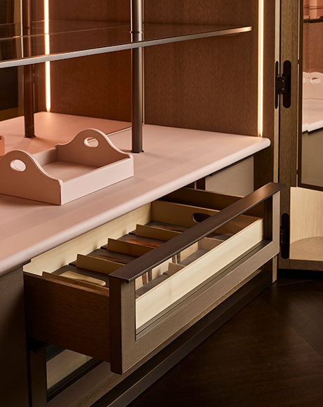 Wardrobe interior with tactile surfaces and softly lit details